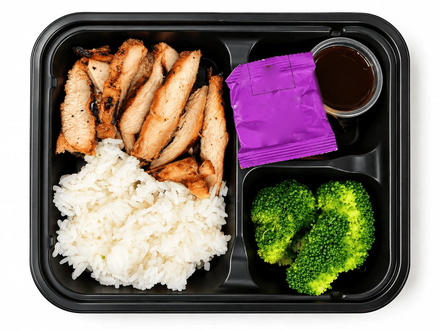 Kids Chicken Teriyaki Platter with grilled teriyaki chicken, jasmine rice, broccoli, teriyaki sauce and a fruit gummy pouch